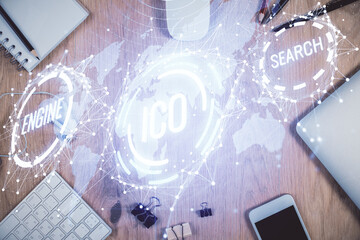 Double exposure of blockchain theme hologram over table with phone. Top view. Crypto technology...