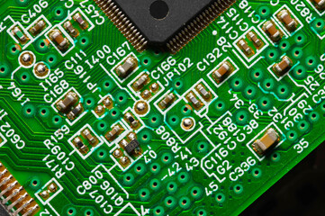 close-up of a printed circuit board with microchips and radio parts with a processor. Background for electronics
