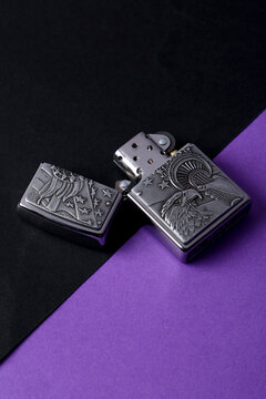 Jeddah Saudi Arabia March 31 2021 Zippo lighter on a Purple coloured background retro lighter.Zippo lighters have gained popularity as windproof lighters.