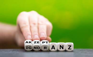 Hand turns dice and changes the German word  