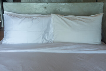 White pillows on a bed Comfortable soft pillows on the bed.