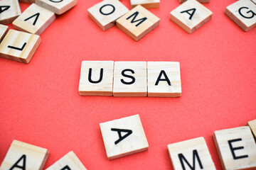 USA word on wooden cube blocks on with letters all around. Concept