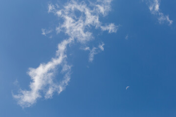 The white crescent moon in the afternoon cool white clouds on beautiful afternoon sky background Images for clear sky background design make you feel fresh and airy.