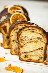 Panettone is the traditional Italian dessert for easter in 2021. Homemade panettone covered in chocolate and sprinkles. Bread served as dessert.