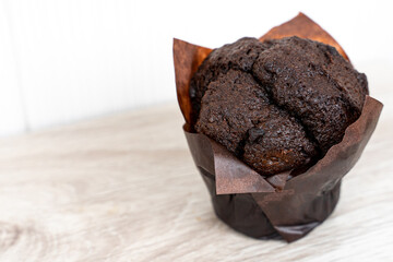 Chocolate cupcake, home bakery on a light background