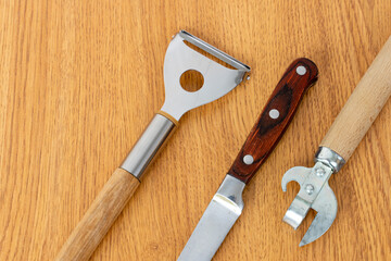 Kitchen utensils on a wooden background