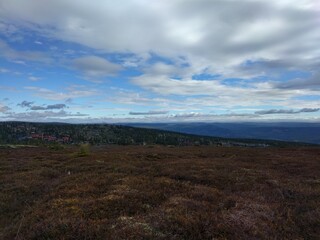landscape in the mountains with clouds and blue sky