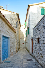 A small street in the medieval quarter of Trogir, an old Croatian town.