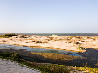 The white sand dunes on a beach off the coast of the island of Dhanushkodi near the town of Rameswaram in Tamil Nadu, India.