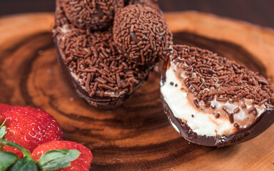 Chocolate Easter Egg filled with powdered milk brigadeiro (brigadier), Goumert egg chocolate tradition in Brazil.