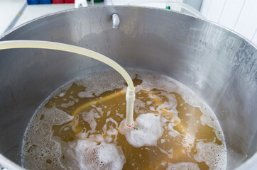 Making craft beer, stainless steel homebrewing equipment, recirculating the must.
