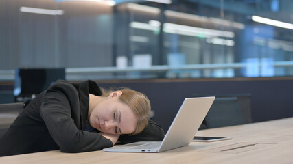 Sleepy Businesswoman Taking Nap at Work 