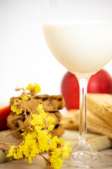 Glass of fresh, pure, organic milk with cookies, waffles and fresh apples is a delicious and healthy breakfast or morning snack.
