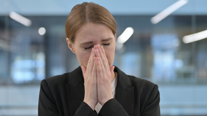 Portrait of Sick Businesswoman Sneezing 