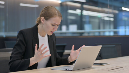 Businesswoman Feeling Angry While using Laptop 