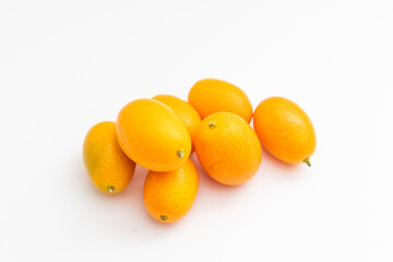 kumquat on white background. exotic fruits