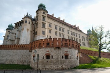 Fototapeta na wymiar Wawel Royal Castle in Krakow, Poland. Exterior view with defensive walls.