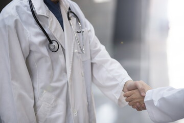 Close up of doctors shaking hands