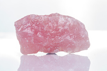 macro mineral stone rose quartz on a white background