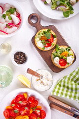 Round crispbread toast with greens and vegetables. Healthy food concept.