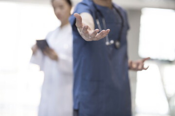 Doctor offering helping hand.Friendly and cheerful gesture.