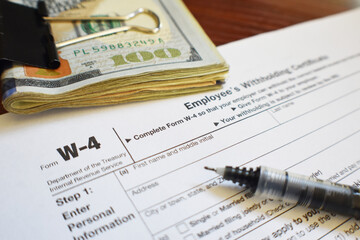 W-4 Tax Form Close Up With Money And Pen 