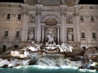 Fototapeta na wymiar Trivoli fountain made of white Carrara marble in the evening