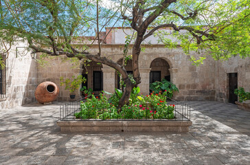 Inner patio or courtyard with white volcanic sillar stone architecture, Arequipa, Peru.