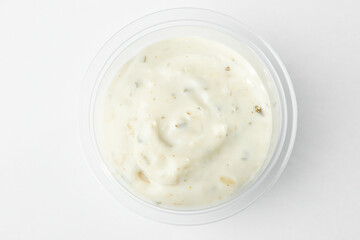 Small cup of tartar sauce, top view on white background