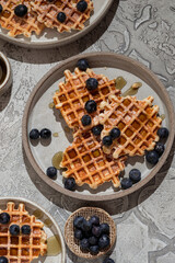 waffles with blueberries and syrup