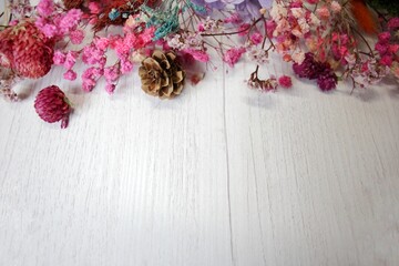Dried flowers on rustic wooden planks background