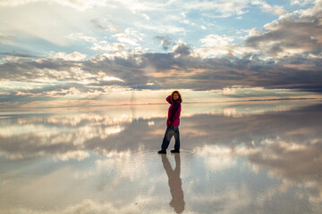 a woman on the reflection of the sunrise