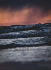 Sunset over the Baltic sea. Waves and clouds.
