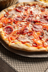 Pizza on the table with dishes and oils and french fries, Italian cuisine. Fried french fries. restaurant service. Food.