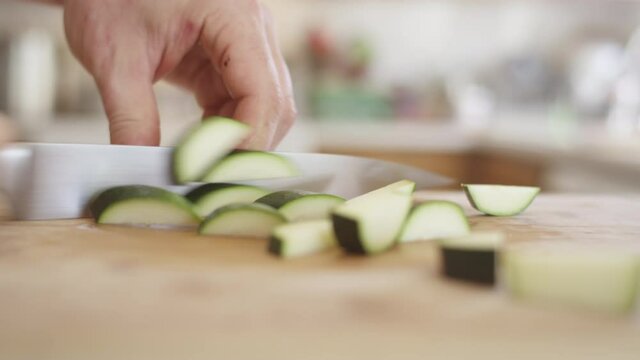 Chopping up a fresh zucchini squash for the cookout