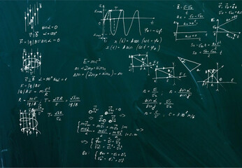Handwritten equations on a green blackboard