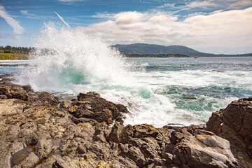 The Pacific Ocean coast in the city of Monterey in California. United States of America. Beautiful beach on a sunny day. Ocean landscape.