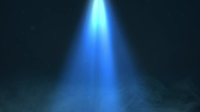 The directional spotlight beam shines blue through smoke and particles.