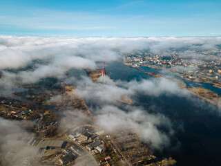 Aerial drone view  to The Riga Radio and TV Tower Riga. In the background Zakusala, river Daugava and the city of Riga