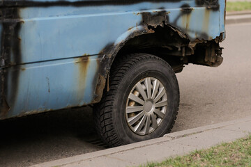 Close up of rusty wheel of old car