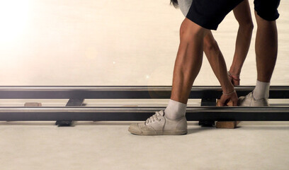 Dolly track setting up by film crew man. Behind the scene of video production crew setting dolly track in studio with professional equipment. Set up for shooting vdo production. film industry concept