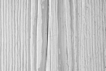 Light dry wooden surface, cracked with age. Old pale wood. Natural white background. Hard sunlight with shadows. Bleached decolorized backdrop. Close-up