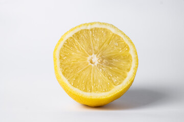 Lemon in cut on a white background. fresh and juicy lemon, cut in half. background