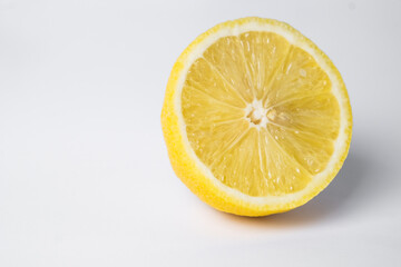 Lemon in cut on a white background. fresh and juicy lemon, cut in half. background