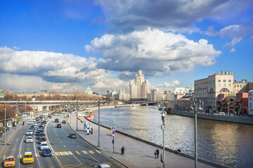 Fototapeta na wymiar View of the Moskva River and the skyscraper on Kotelnicheskaya Embankment from the Bolshoy Kamenny Bridge in Moscow