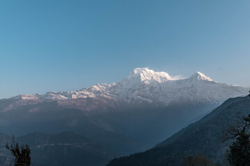 Fototapeta na wymiar Annapurna south early morning view on the Annapurna south and Huinсhuli mountains from the Mards Himal range.