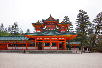 Fototapeta premium View of Souryu-rou Tower in the inner courtyard of Heian Shrine with overexposed blown out sky. No people. Popular tourist destination.