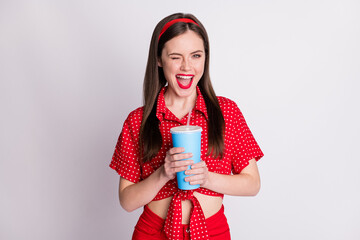 Photo of cheerful coquette girl hold plastic cup blink eye open mouth wear red dotted blouse...
