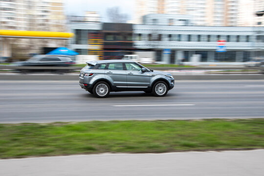 Ukraine, Kyiv - 6 April 2021: Silver Land Rover Range Rover Evoque Car Moving On The Street. Editorial