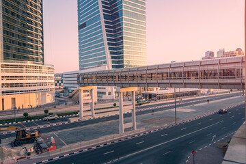 An elevated pedestrian crosswalk over a street and expressway in Dubai. Urbanism and landscaping